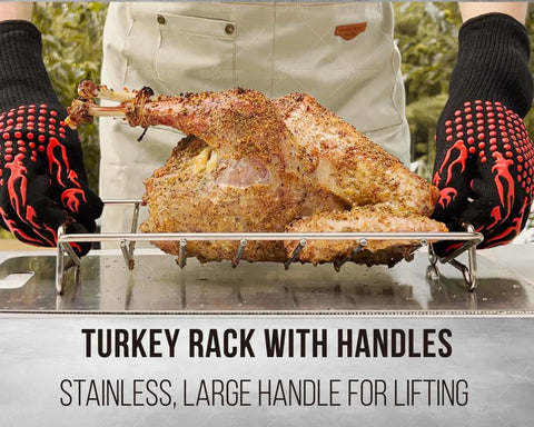 Cook lifting turkey on V Shaped Stainless Steel Turkey Roasting Rack For Oven And Kamado Grills, with large handles for lifting.
