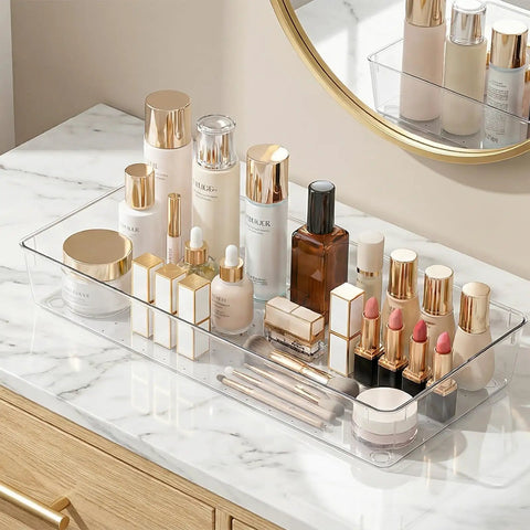 4 Pack 15x6 Inch Extra Large Clear Plastic Drawer Organizer Trays For Vanity Makeup Kitchen Utensils Bathroom Office Desk Auto Tools And Craft Supplies Ultra Handy Multi Purpose Storage Bins shown with makeup items on a vanity.