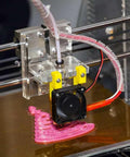 PTFE tubing kit for 3D printer with PC4-M6/PC4-M10 fittings; clear tubing and yellow clamps on extruder