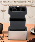 Cut Through Stubborn Coffee Grit Like Butter With This Easy Going Electric Portafilter Cleaner showing detachable components and a stainless steel exterior.