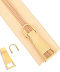 Six Piece Gold Zipper Pull Replacement Set In Gold Zinc Alloy For Luggage Backpacks Jackets Suitcases And Coats With Three Sizes for Quick Repairs shown installed on zipper