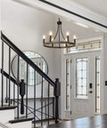 Wagon Wheel Chandelier For Dining Room, 6 Light Farmhouse Pendant With Wood Grain Finish in a modern foyer setting