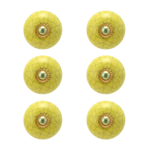 Real Deal Handmade Ceramic Drawer Knobs For Dressers And Kitchen Cabinets Featuring Snazzy Yellow Crackle Finish and four round yellow knobs.