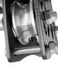 Close-up of Beefy Tandem Speed Double Pulley System For Zip Lines 45kN Break Load, high tensile steel with bolts visible.