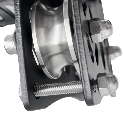 Close-up of Beefy Tandem Speed Double Pulley System For Zip Lines 45kN Break Load, high tensile steel with bolts visible.