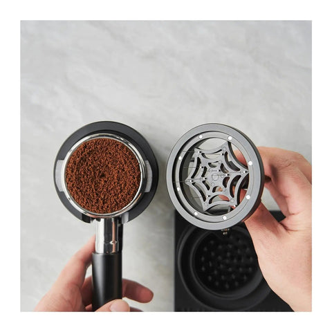 Espresso Knock Box And Pro Tamper Combo Fits Most Portafilters Heavy Duty Abs Build. Close-up of portafilter and calibrated tamper with ground coffee.