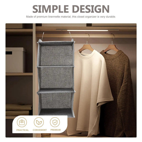 Three Tier Hanging Wardrobe Organizer With Slick Foldable Linen Fabric And Heavy Duty Hooks For Ultimate Closet Space Saving and Dorm Game Changer Essentials in grey with shirts.
