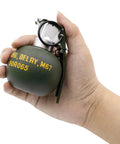 Person holding Dummy Grenade Replica Made From Durable Nylon Plastic For Airsoft Tactics And Cosplay Gear Lightweight Nonfunctional Prop Grenades Perfect For Army Fans Movie Props Outdoor Games And Storage M67