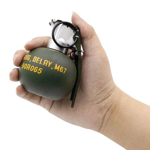 Person holding Dummy Grenade Replica Made From Durable Nylon Plastic For Airsoft Tactics And Cosplay Gear Lightweight Nonfunctional Prop Grenades Perfect For Army Fans Movie Props Outdoor Games And Storage M67
