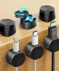 360 Degree Magnetic Cable Clips For Desk And Car, Black clips securing various cables on a wooden desk setup, 6 Pack