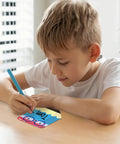 Child writing name on colorful 36 pack pencil desk name plates with waterproof PET film for classroom organization and student name tags