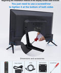 Back view of installation process for 27 Inch CCTV Monitor For Surveillance With Full HD 1920x1080 Display Security Camera Monitor All In One Plug And Play Multi Interface HDMI AV BNC VGA USB PC Input LCD Screen Borderless Design Ready To Go For Home Office, showing a screwdriver tightening the base with accessories like remote and power adapter displayed.