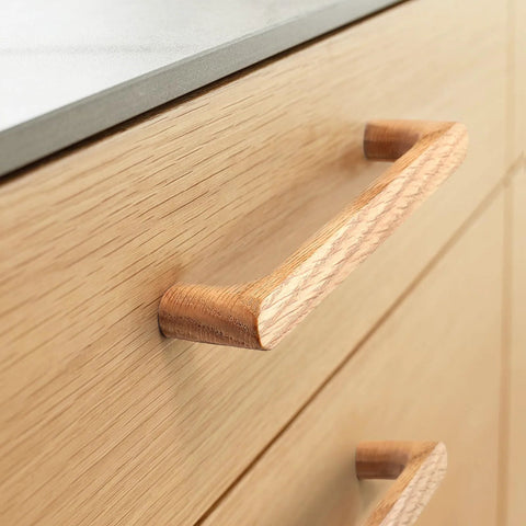 Close-up of Walnut Round Wooden Drawer Pulls 5 Inch Four Pack for Cabinets and Kitchen Doors showing smooth wood finish on cabinet