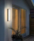 Dope Outdoor Wall Light LED 26W Modern Exterior Sconce With Resin Marble Shade illuminating house exterior at night