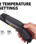 Person holding the All In One Dual Temperature Electric Heat Gun Kit HT400 680F And 450F for wire repair and DIY projects.