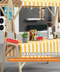 Collapsible Wooden Vendor Cart With Canopy featuring a spacious striped countertop for street food and outdoor events.