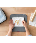 Cricut EasyPress mat, 12 x 12 in gray heat-resistant mat for HTV/iron-on projects, front view.