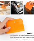 Pro Grade 6 Piece Body Filler Spreader Set With 4 Inch 5 Inch And 6 Inch Reusable Plastic Scrapers For Automotive Paint Repairs Caulks Putties And General Body Work Ideal For Smooth Even Applications On Various Surfaces. Orange plastic body filler spreader applying putty on a car panel