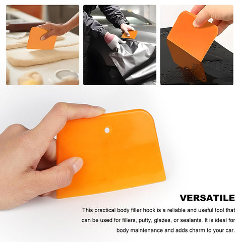 Pro Grade 6 Piece Body Filler Spreader Set With 4 Inch 5 Inch And 6 Inch Reusable Plastic Scrapers For Automotive Paint Repairs Caulks Putties And General Body Work Ideal For Smooth Even Applications On Various Surfaces. Orange plastic body filler spreader applying putty on a car panel