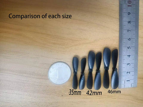 Pro Grade 20-Pack 1.38 Inch Mini Propellers For RC Aircraft 0.03 Inch Axle Shaft with size comparison to ruler and coin