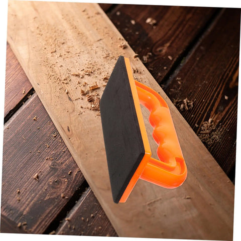 Safety Push Block for Table Saws and Router Tables Lightweight Portable Orange Woodworking Push Block for Workshops Safer Cuts and Precise Control All Day Performance with ABS handle and base on a wooden surface.