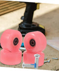 24 Pieces Roller Skate Stopper Screws Kit For Inline And Quad Skates Easy To Install Brake Screws Non Corrosive Hardware Bearing Replacement Screws Kit with pink wheels and screws displayed outdoors