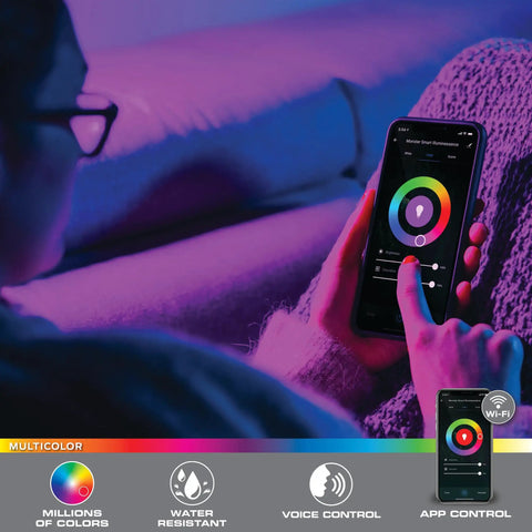 Person using app to control Smart Multicolor LED Light Strip 6.5 Feet With App Control And Dimmable Color Changing Lighting for home ambience.