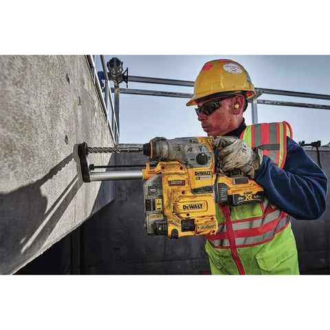 Worker using Onboard Dust Extractor for 1-1/8-Inch SDS Plus Rotary Hammers With Clear Dust Box and Replaceable Nozzle