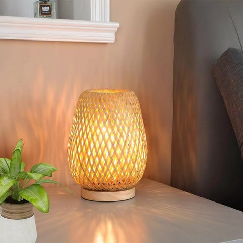 Vintage Dope Gold Industrial Table Lamp With Rustic Metal Cage Shade For Nightstand And Desk, E26 Base, lit on nightstand.