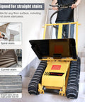 Ultra Heavy Duty Electric Stair Climbing Dolly With 880 Lb Capacity And 360 Degree Turn Swivel on stairs, showing foldable design and robust tracks.