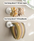 Suction Cup Headband Holder And Wall Mounted Hair Accessory Organizer Keeps Your Bathroom Vanity Looking Fly With This Hassle Free No Drill Scrunchie Storage Rack In Crisp White. Holds 7-10 hair ties and headbands.