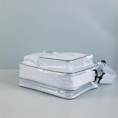 Slick Clear PVC Crossbody Bag Built Tough For Cleanroom Sites with a zippered compartment and adjustable strap.