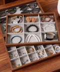 Dope Wooden Velvet Jewelry Organizer Tray With Nine Grid Compartments Stackable Ring Earring Necklace Valet Dish displaying rings and bracelets.