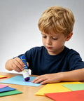 Child using Purple Glue Sticks 22g Pack Of 3 For Office And School Projects Goes On Purple Dries Clear On Paper