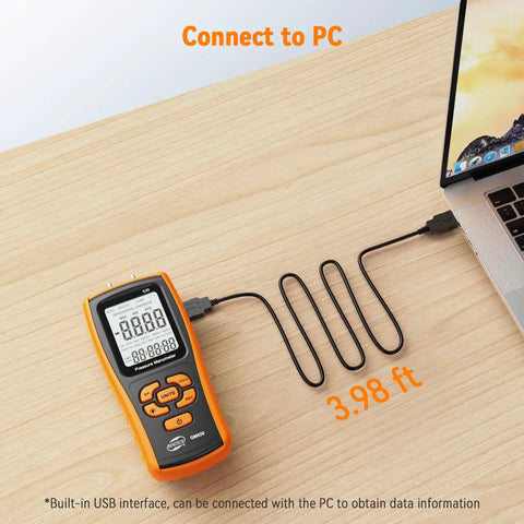 Handheld Manometer Gas Pressure Tester for HVAC Pros and DIYers connected to laptop via USB for data export.