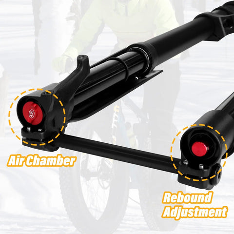 Close-up of 20 Inch Fat Tire Mountain Bike Fork With Beefed Up Inverted Air Suspension, 15x150mm Thru Axle, highlighting air chamber and rebound adjustment on snow bike background.