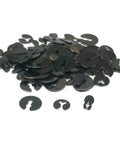 Pile of assorted black washers from 100 Wall Clock Washers Replacement Kit All In One With Split Jumping Oval Parts For Repairs And Maintenance Of Clocks