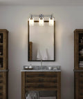 Three Light Matte Black Bathroom Vanity Lights With Clear Glass Shades Dope Over Mirror Modern Wall Sconce in bathroom setting.