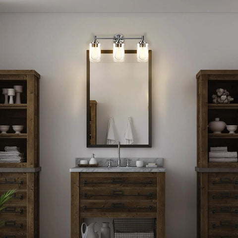 Three Light Matte Black Bathroom Vanity Lights With Clear Glass Shades Dope Over Mirror Modern Wall Sconce in bathroom setting.