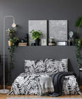 Bedroom with Holden 70 Inch Floor Lamp in Brushed Steel with Inline On Off Foot Switch next to a bed against a dark wall