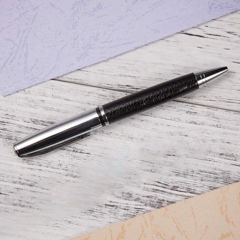 Rotary 0.5mm Ballpoint Pen Set With Leather Grip, Metal Body And Smooth Gel Ink on wooden background