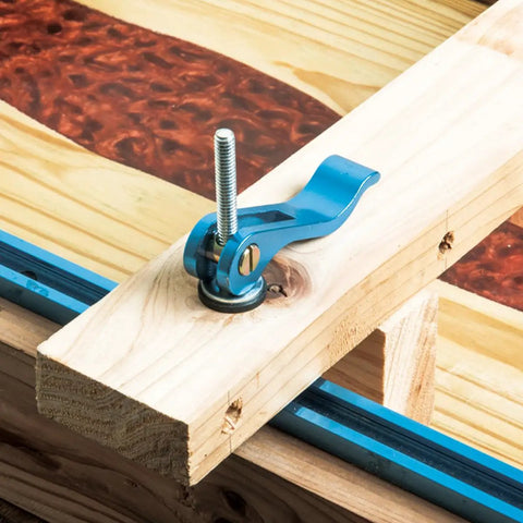 Four Pack Cam Lever Clamps With Three Inch T Track Bolts Dead Nuts Tight Fast Woodworking Jig And Router Table Gear With One Quarter Inch Twenty Thread Insert Rugged Bench And Cnc Tools For Shop Gigs mounted on wood with T track.