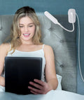 Clip On Desk Lamp With Flexible Gooseneck 7W 2600mAh Battery Operated Rechargeable Reading Light next to woman on bed
