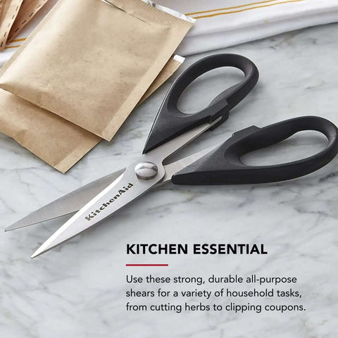 All Purpose Kitchen Shears with Protective Sheath, Rust Resistant Stainless Steel Blades, Micro Serrated Edges on a countertop.