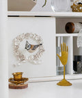 Set Of Four Metal Bird Cabinet Knobs With Colorful 3D Design Decorative Pull Handles For Doors Cabinets And Drawers Vintage Pewter Finish Delicate Yet Bold Home Decor set against a vintage-style cabinet with decorative items.