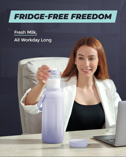 Keep Your Nursing Stash Chill Without Any Stress Using This Leakproof Breast Milk Travel Chiller That Attaches Straight To Pumps And Keeps Fresh Milk Cold All Day Long, modeled by a woman at a desk.