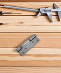 Self-Closing Hydraulic Door Hinges For Wood Doors With 90 Degree Positioning And Hidden Design on a wood background
