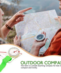 Person holding map and Portable Hiking Compass Thumb Orienteering Tool With Precision Acrylic Construction in nature setting.