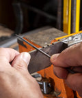 Using 6 Piece Miniature File Set With Assorted Shapes For Detail Work on metal, precision Swiss pattern file in action.