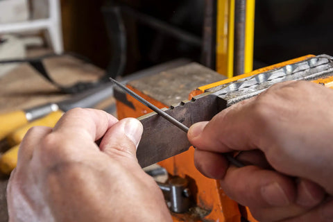 Using 6 Piece Miniature File Set With Assorted Shapes For Detail Work on metal, precision Swiss pattern file in action.